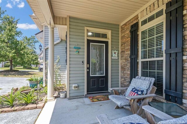50 Turner Mathews Ct, Spring Lake, NC 28390 - view of exterior entry featuring covered porch