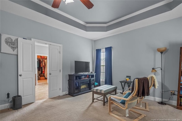 50 Turner Mathews Ct, Spring Lake, NC 28390 - living room featuring carpet floors, ornamental molding, a ceiling fan, and a tray ceiling