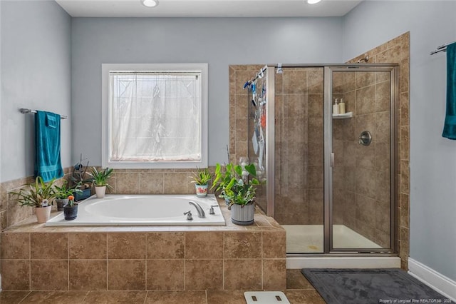 50 Turner Mathews Ct, Spring Lake, NC 28390 - bathroom featuring a garden tub and a stall shower
