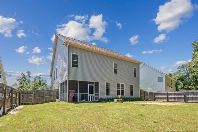 50 Turner Mathews Ct, Spring Lake, NC 28390 - rear view of house featuring a sunroom and a fenced backyard