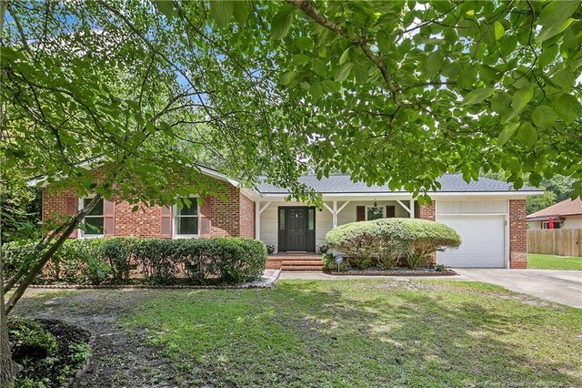 2012 Cobblestone Pl, Fayetteville, NC 28304 - ranch-style home with brick siding, an attached garage, and concrete driveway