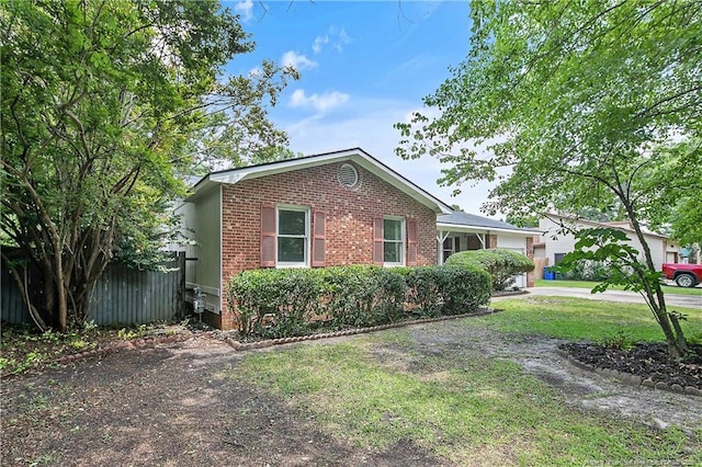 2012 Cobblestone Pl, Fayetteville, NC 28304 - view of side of property with brick siding and driveway