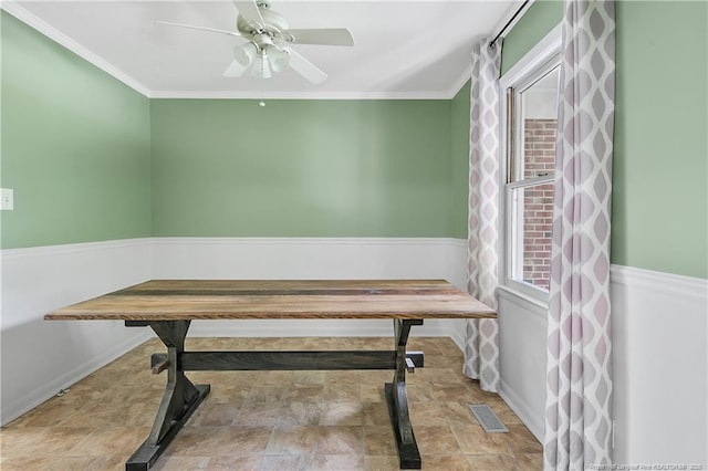 2012 Cobblestone Pl, Fayetteville, NC 28304 - dining area featuring stone finish floors, a ceiling fan, and crown molding