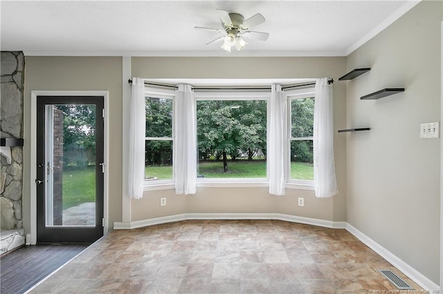 2012 Cobblestone Pl, Fayetteville, NC 28304 - doorway to outside with plenty of natural light, ceiling fan, ornamental molding, and stone finish floors