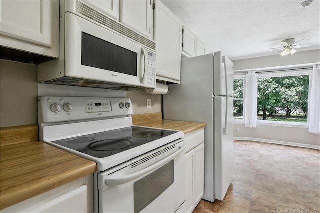 2012 Cobblestone Pl, Fayetteville, NC 28304 - kitchen featuring white appliances, a ceiling fan, white cabinets, and a textured ceiling
