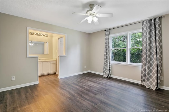 2012 Cobblestone Pl, Fayetteville, NC 28304 - spare room featuring ceiling fan and dark wood-type flooring