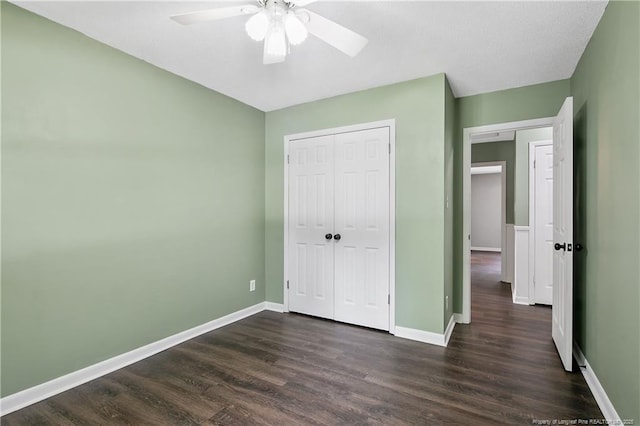 2012 Cobblestone Pl, Fayetteville, NC 28304 - unfurnished bedroom with dark wood finished floors, a closet, and a ceiling fan