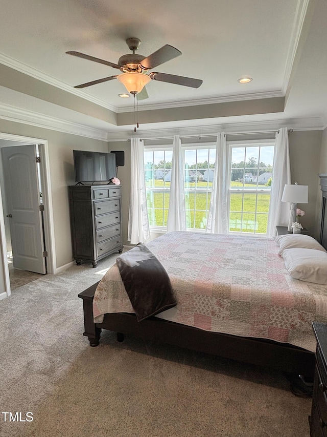 644 Wall Rd, Wendell, NC 27591 - bedroom featuring a tray ceiling, multiple windows, ornamental molding, light carpet, and ceiling fan