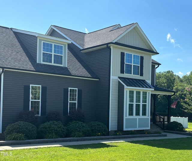 644 Wall Rd, Wendell, NC 27591 - view of side of property featuring a yard, a shingled roof, and board and batten siding