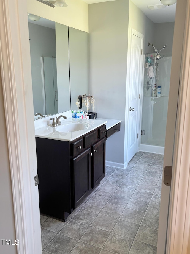 644 Wall Rd, Wendell, NC 27591 - full bathroom with a stall shower, vanity, and tile patterned flooring