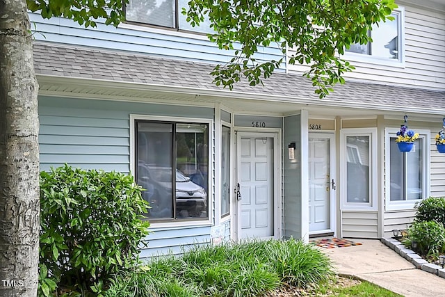5810 Shady Grove Cir, Raleigh, NC 27609 - property entrance with a shingled roof