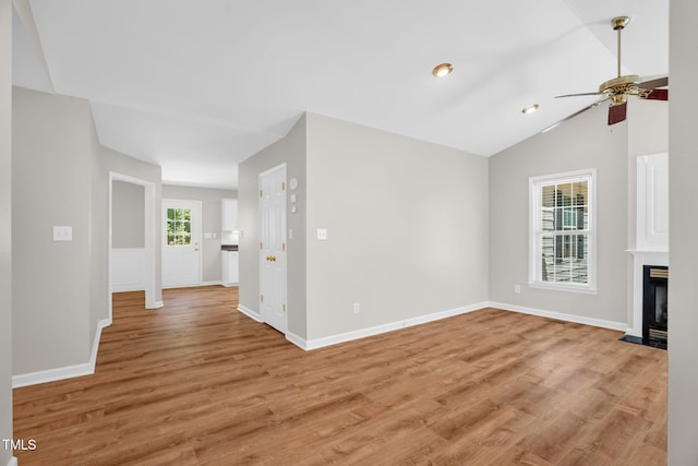 514 Lipscomb Grove Church Rd, Hillsborough, NC 27278 - unfurnished living room featuring ceiling fan, light wood-style flooring, a fireplace with flush hearth, and vaulted ceiling