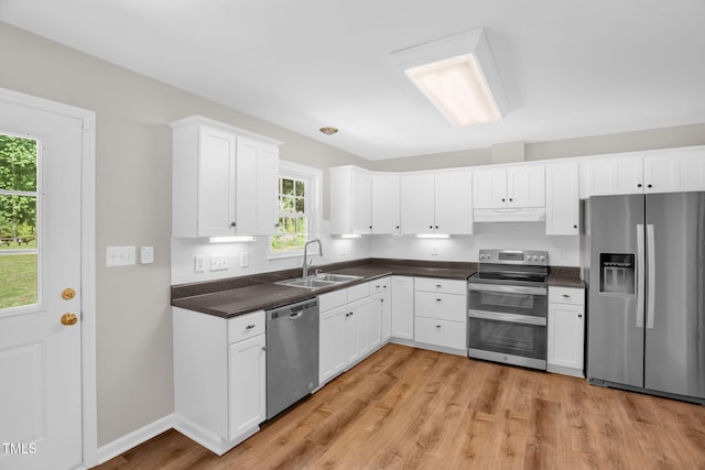 514 Lipscomb Grove Church Rd, Hillsborough, NC 27278 - kitchen with appliances with stainless steel finishes, under cabinet range hood, healthy amount of natural light, and dark countertops