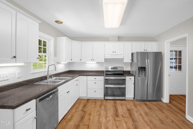514 Lipscomb Grove Church Rd, Hillsborough, NC 27278 - kitchen with appliances with stainless steel finishes, under cabinet range hood, light wood-style floors, and dark countertops