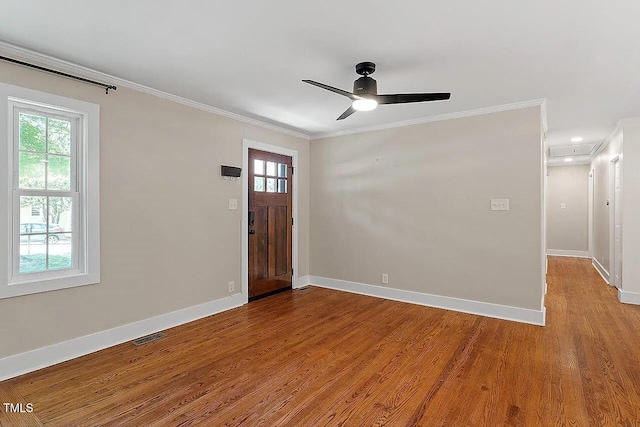 2609 Elmhurst Cir, Raleigh, NC 27610 - entryway with ornamental molding, wood finished floors, ceiling fan, and recessed lighting