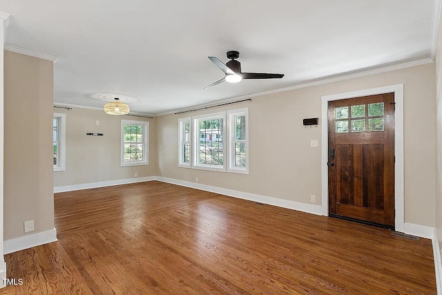 2609 Elmhurst Cir, Raleigh, NC 27610 - entrance foyer with ornamental molding, ceiling fan, and dark wood-style floors