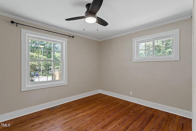 2609 Elmhurst Cir, Raleigh, NC 27610 - spare room featuring dark wood-style floors, ornamental molding, and a ceiling fan