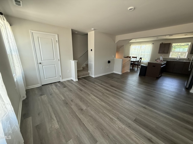 4500 Black Drum Dr, Raleigh, NC 27616 - living room with stairway and dark wood finished floors