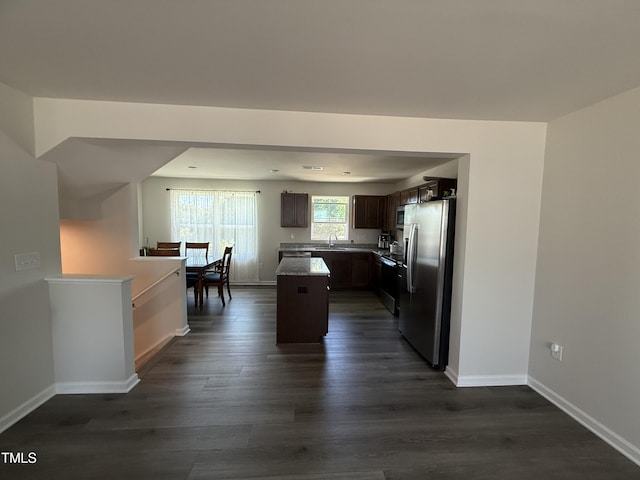 4500 Black Drum Dr, Raleigh, NC 27616 - kitchen with freestanding refrigerator, a center island, dark brown cabinetry, and dark wood-type flooring