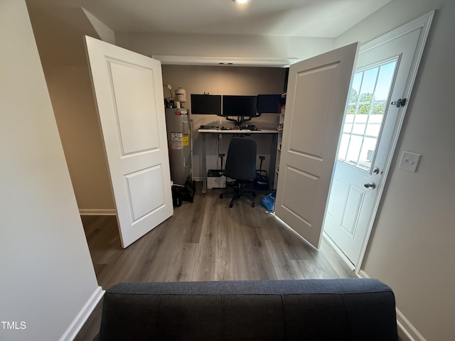 4500 Black Drum Dr, Raleigh, NC 27616 - office area featuring electric water heater and wood finished floors