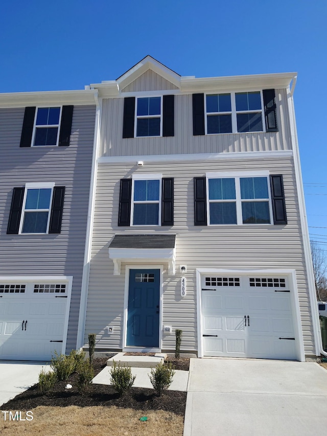 4500 Black Drum Dr, Raleigh, NC 27616 - view of front facade featuring a garage, driveway, and board and batten siding