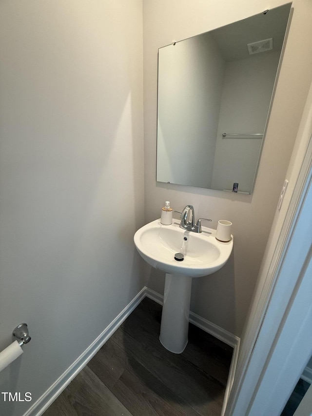 4500 Black Drum Dr, Raleigh, NC 27616 - bathroom featuring wood finished floors and baseboards