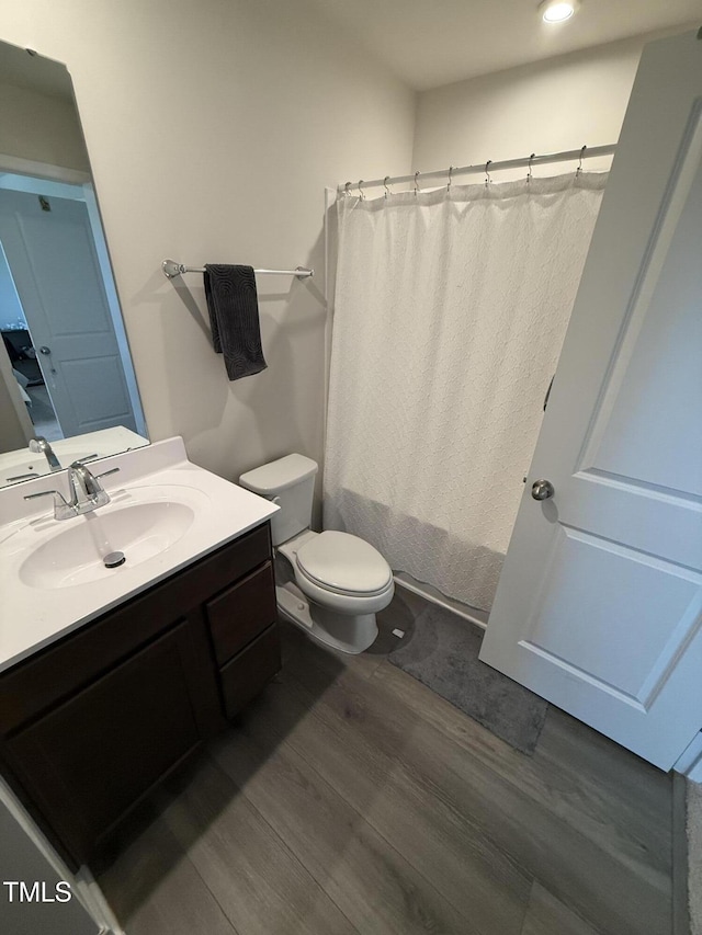 4500 Black Drum Dr, Raleigh, NC 27616 - bathroom with wood finished floors, vanity, and a shower with curtain