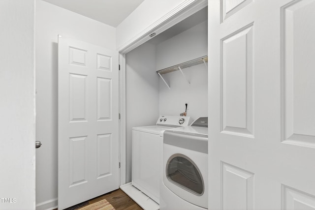 108 Hudson Dr, Princeton, NC 27569 - washroom with washing machine and dryer and dark wood finished floors