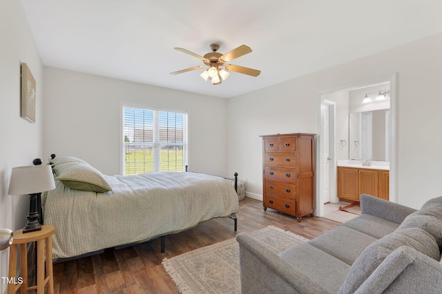 108 Hudson Dr, Princeton, NC 27569 - bedroom with light wood-style floors, ensuite bathroom, and a ceiling fan