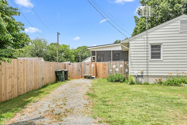 302 Bradley St, Burlington, NC 27215 - fenced yard featuring a sunroom and a gate