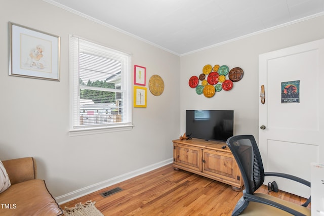 302 Bradley St, Burlington, NC 27215 - home office featuring light wood-type flooring and ornamental molding