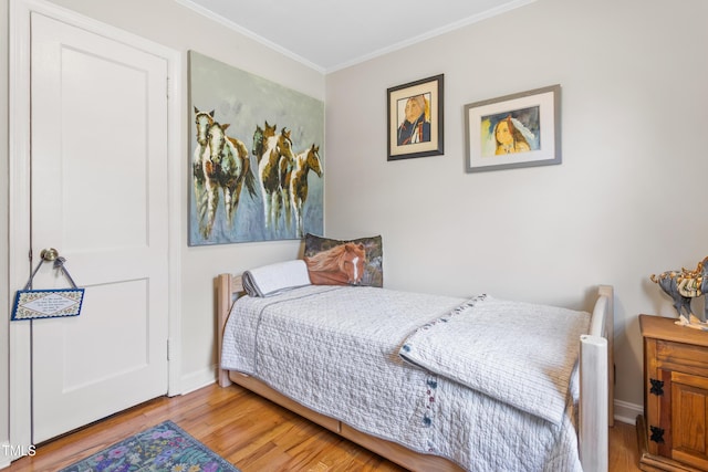 302 Bradley St, Burlington, NC 27215 - bedroom with ornamental molding and wood finished floors