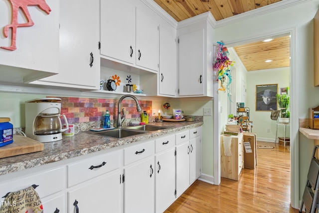 302 Bradley St, Burlington, NC 27215 - kitchen featuring wooden ceiling, light wood-style floors, white cabinets, tasteful backsplash, and recessed lighting