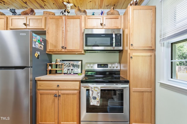 302 Bradley St, Burlington, NC 27215 - kitchen with stainless steel appliances, light brown cabinetry, and light countertops