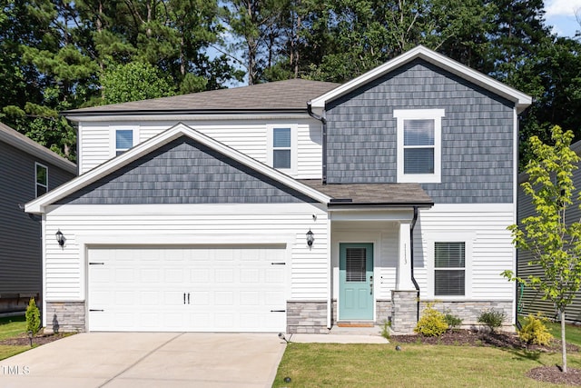 1113 Umstead Grove Way, Durham, NC 27712 - view of front of property featuring stone siding, driveway, an attached garage, and a shingled roof