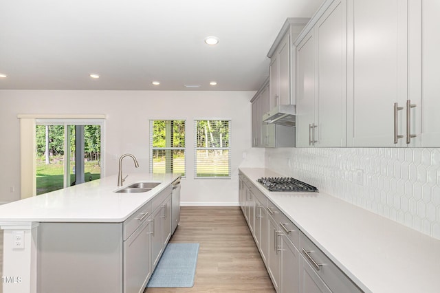 1113 Umstead Grove Way, Durham, NC 27712 - kitchen with stainless steel appliances, gray cabinets, light countertops, light wood-style flooring, and recessed lighting
