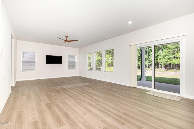 1113 Umstead Grove Way, Durham, NC 27712 - unfurnished living room with ceiling fan, light wood finished floors, and recessed lighting