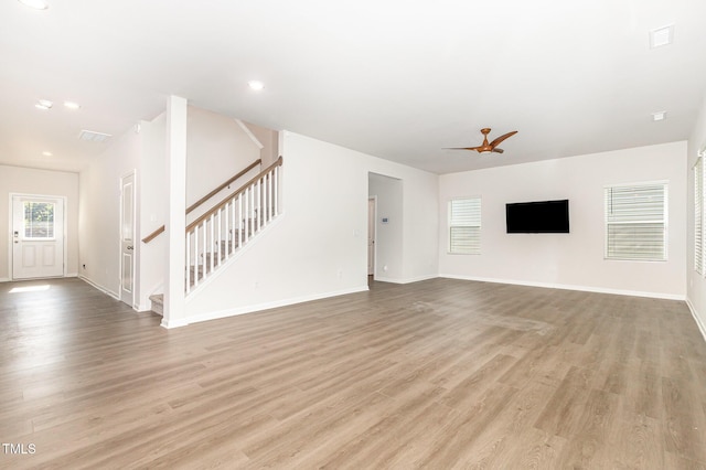 1113 Umstead Grove Way, Durham, NC 27712 - unfurnished living room with stairway, wood finished floors, and recessed lighting