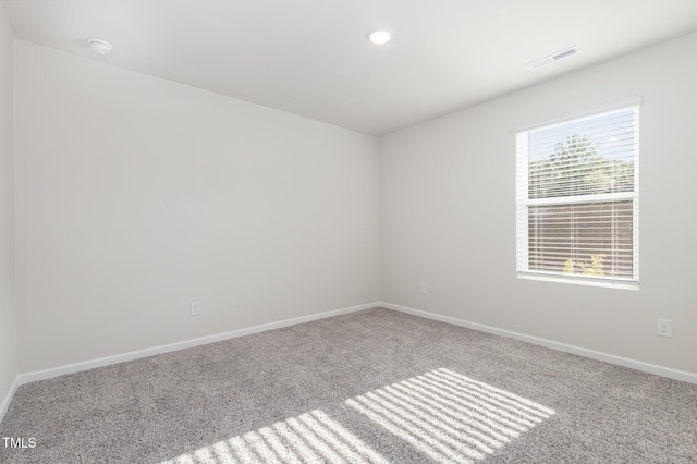 1113 Umstead Grove Way, Durham, NC 27712 - carpeted spare room with a smoke detector and recessed lighting