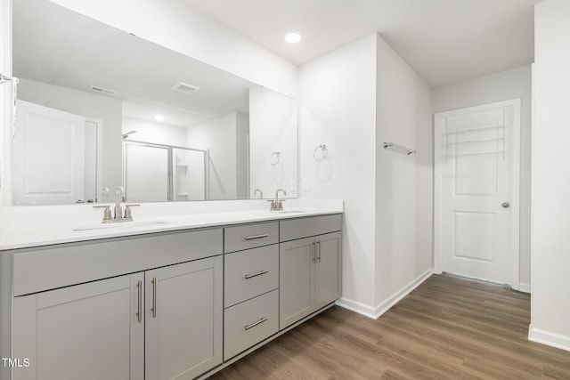 1113 Umstead Grove Way, Durham, NC 27712 - full bath featuring double vanity, wood finished floors, a shower stall, and recessed lighting