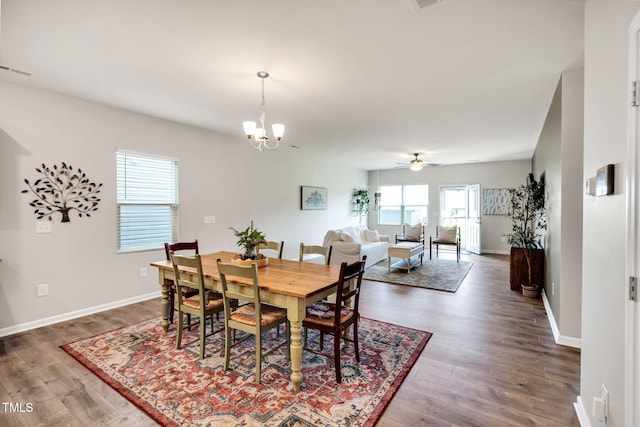 4102 Catfish Way, Durham, NC 27703 - dining space featuring dark wood finished floors, a chandelier, and a ceiling fan