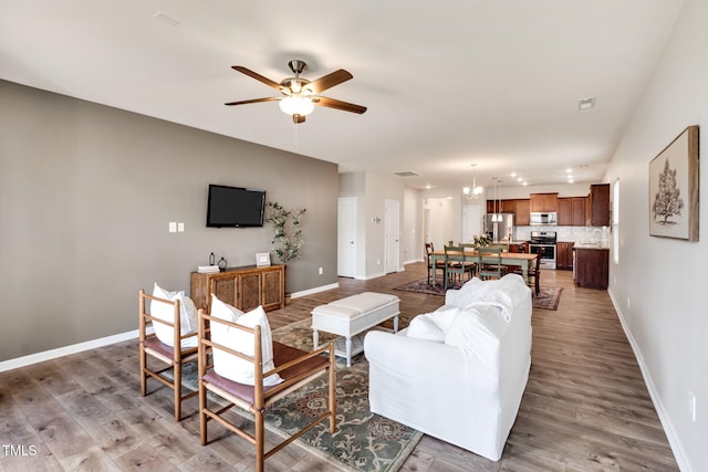 4102 Catfish Way, Durham, NC 27703 - living room with a ceiling fan and wood finished floors