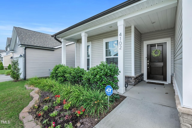 4102 Catfish Way, Durham, NC 27703 - entrance to property with stone siding, covered porch, and roof with shingles