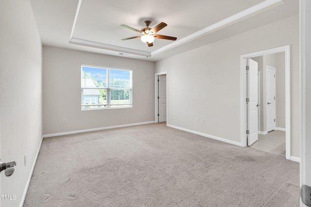 4102 Catfish Way, Durham, NC 27703 - empty room with a tray ceiling, a ceiling fan, and carpet flooring