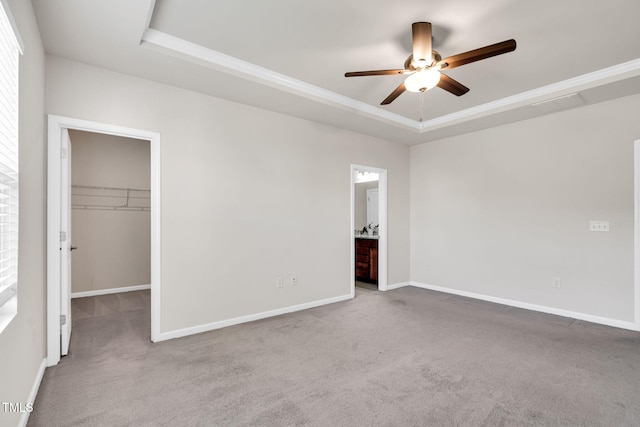 4102 Catfish Way, Durham, NC 27703 - unfurnished bedroom featuring a tray ceiling, carpet flooring, a walk in closet, a closet, and ensuite bath