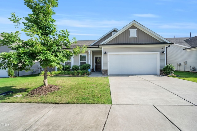 4102 Catfish Way, Durham, NC 27703 - view of front of property with board and batten siding, driveway, a garage, and a front lawn