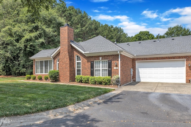 4622 Ludwell Branch Ct, Raleigh, NC 27612 - view of front of home with brick siding, asphalt driveway, a shingled roof, and a chimney