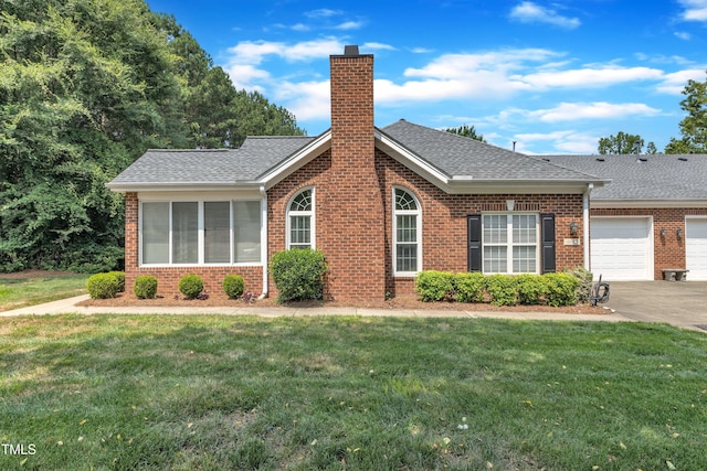 4622 Ludwell Branch Ct, Raleigh, NC 27612 - view of front of home featuring brick siding, a chimney, roof with shingles, a front lawn, and a garage