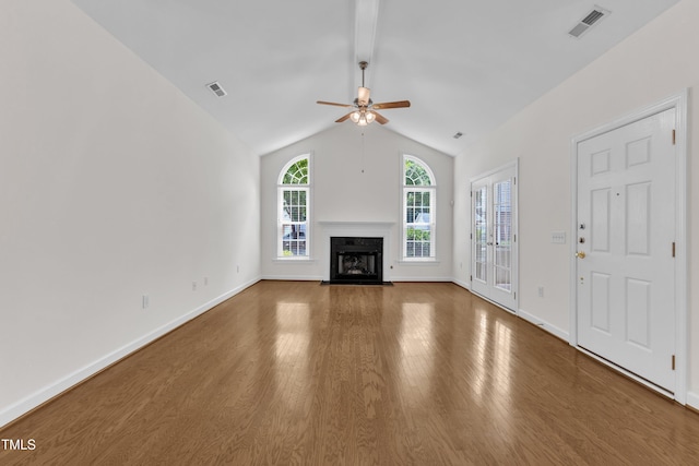 4622 Ludwell Branch Ct, Raleigh, NC 27612 - unfurnished living room with ceiling fan, a fireplace with flush hearth, wood finished floors, and lofted ceiling