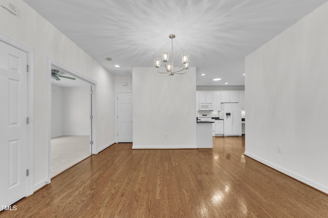 4622 Ludwell Branch Ct, Raleigh, NC 27612 - unfurnished living room featuring wood finished floors, a chandelier, recessed lighting, and ceiling fan